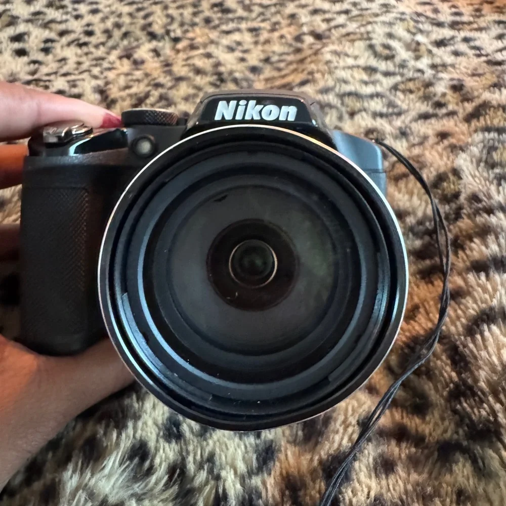 Nikon Black Camera with White Accessories